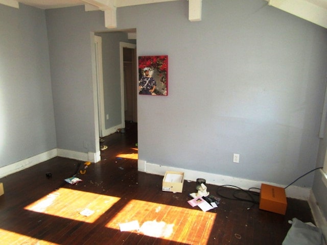 spare room featuring dark hardwood / wood-style flooring