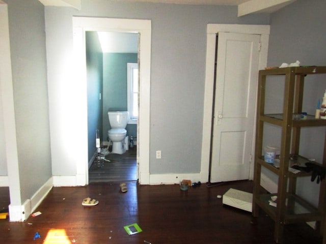 interior space featuring ensuite bath and hardwood / wood-style floors