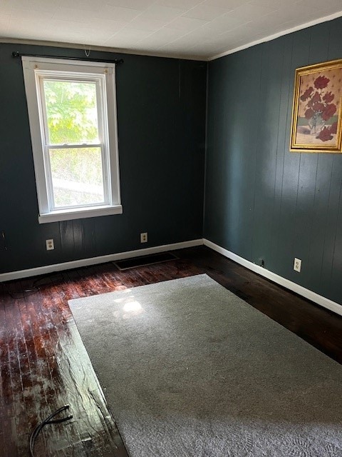 empty room featuring dark hardwood / wood-style floors