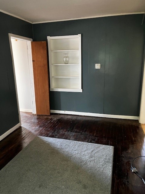 unfurnished room featuring dark hardwood / wood-style flooring