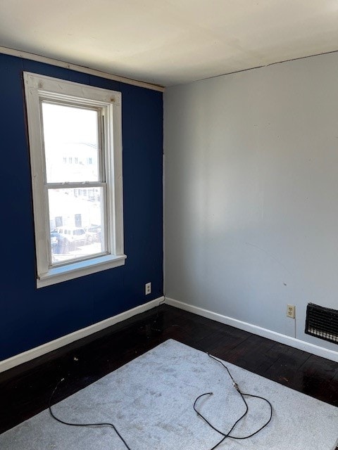 empty room featuring hardwood / wood-style floors