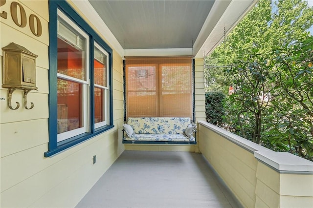 balcony featuring a sunroom