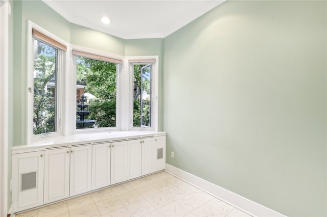 interior space with crown molding