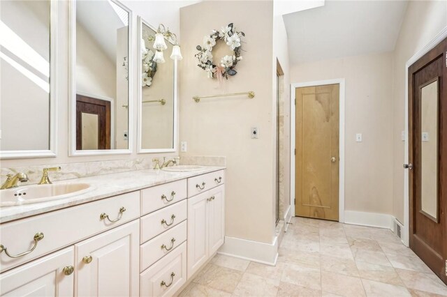 bathroom featuring vanity and a shower with door