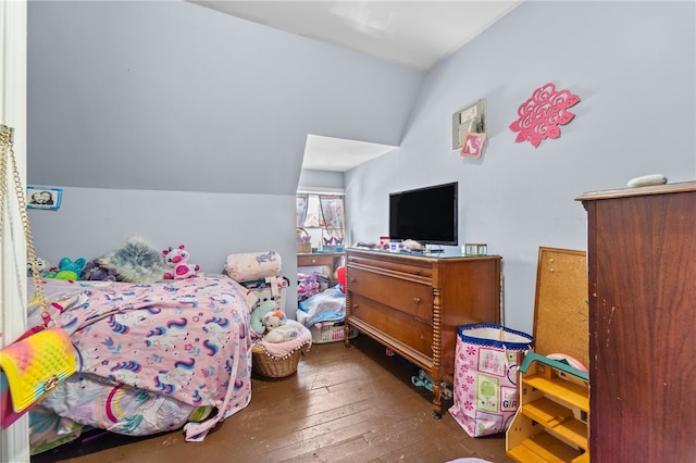 bedroom featuring vaulted ceiling and hardwood / wood-style flooring