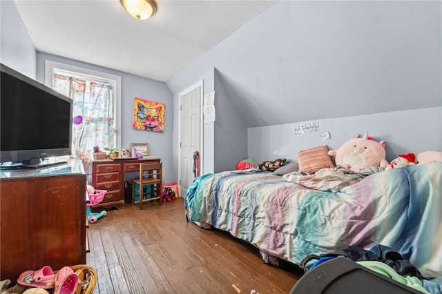 bedroom featuring wood-type flooring and lofted ceiling