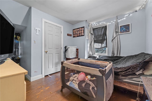 bedroom with hardwood / wood-style floors