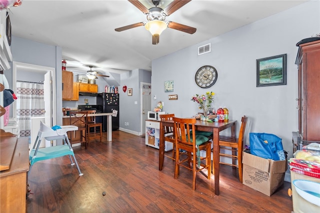 dining room featuring dark hardwood / wood-style floors and ceiling fan