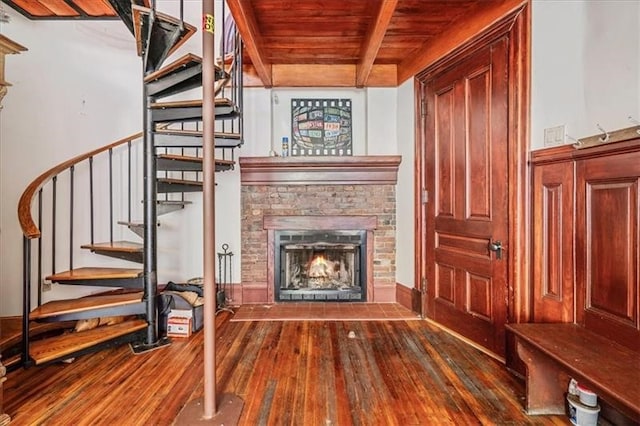 unfurnished living room with wooden ceiling, wood-type flooring, and beam ceiling