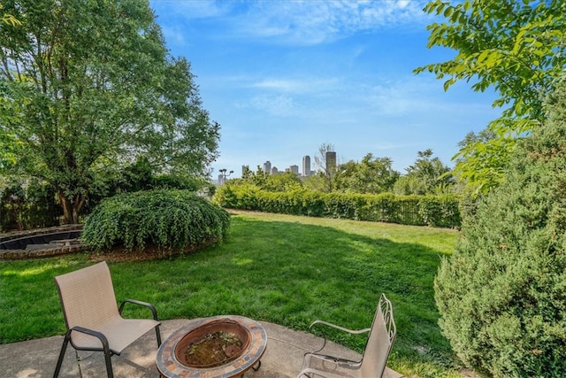 view of yard with a patio and a fire pit