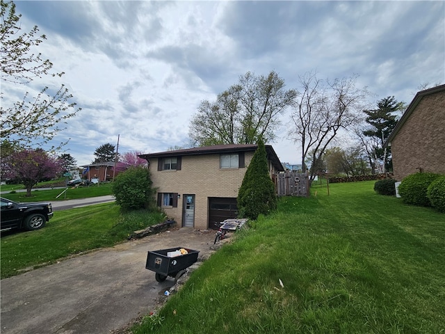 view of side of property with a yard