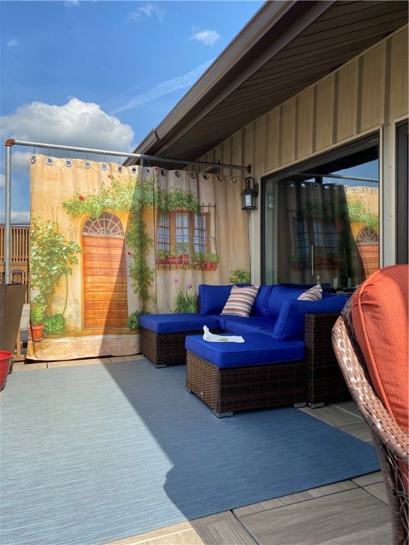 wooden deck featuring an outdoor living space