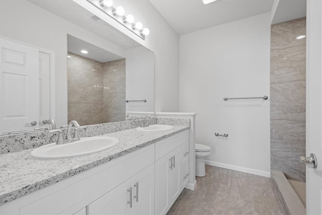 bathroom featuring double sink, toilet, tile flooring, and oversized vanity