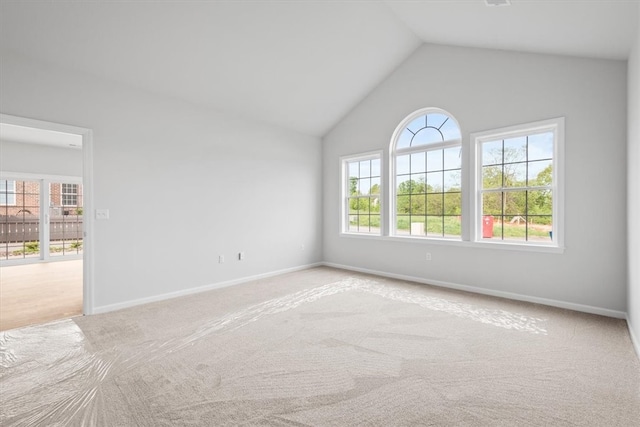 empty room featuring plenty of natural light and carpet