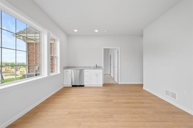 unfurnished room featuring light hardwood / wood-style flooring