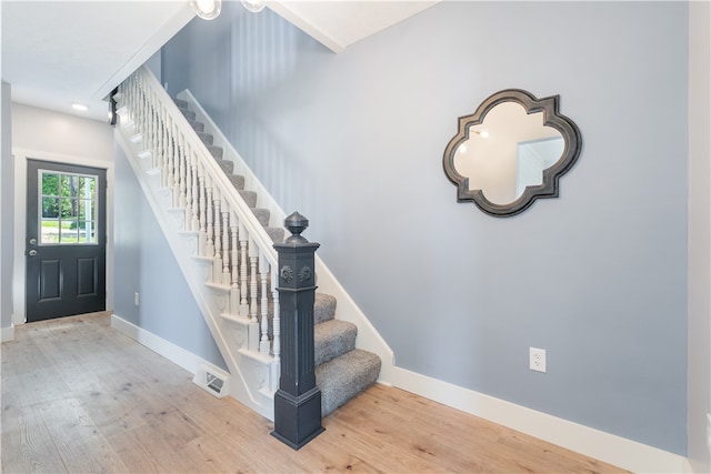 staircase featuring hardwood / wood-style floors