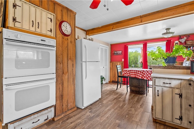 kitchen with hardwood / wood-style floors, white appliances, and ceiling fan