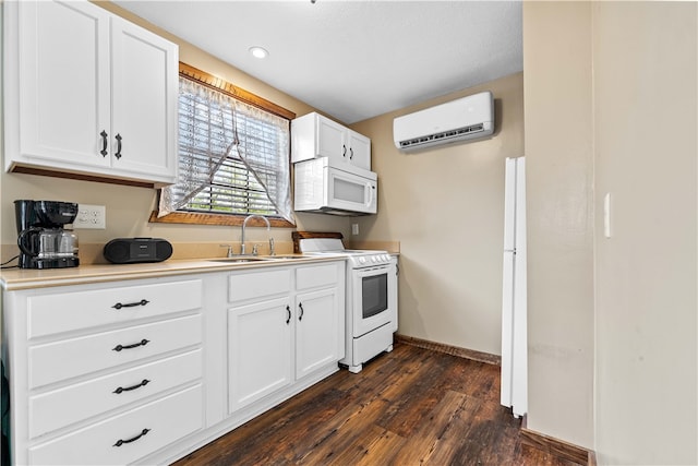 kitchen featuring white appliances, dark wood-type flooring, an AC wall unit, white cabinets, and sink