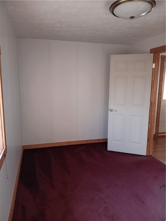 empty room featuring carpet flooring