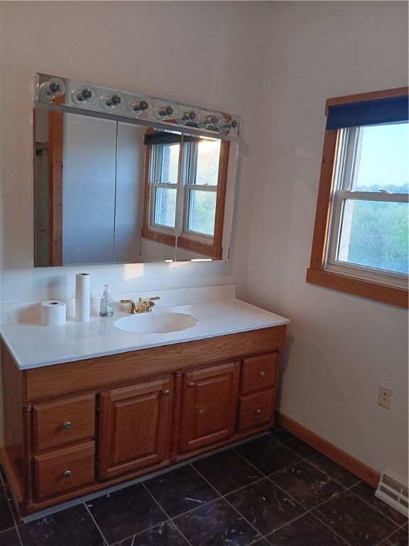 bathroom featuring tile floors and oversized vanity