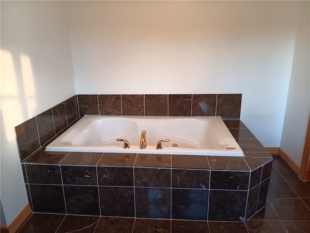 bathroom featuring tile floors and tiled bath