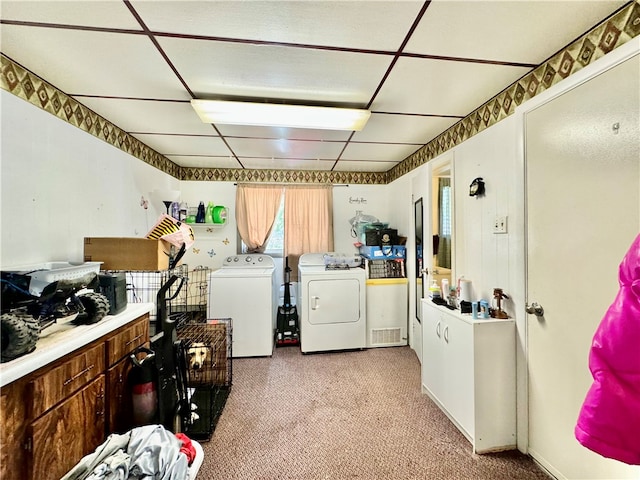 washroom with independent washer and dryer and light carpet