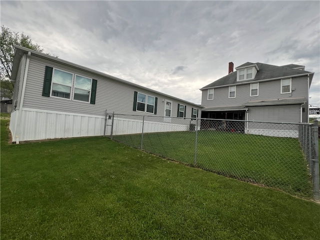 back of house featuring a yard