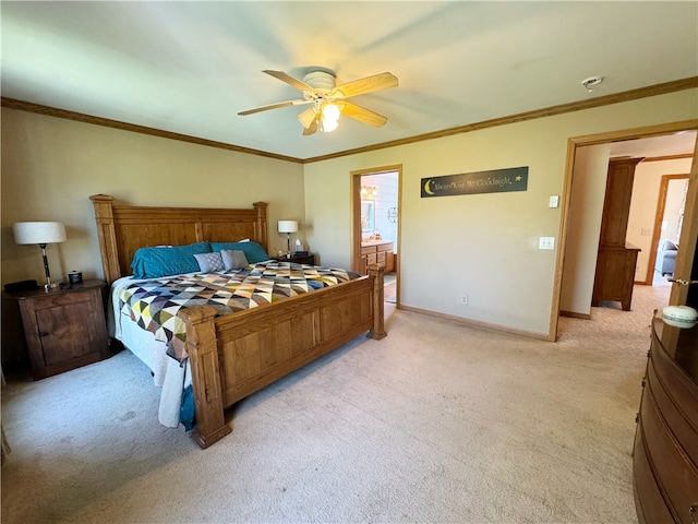 bedroom with carpet flooring, ensuite bathroom, ceiling fan, and crown molding