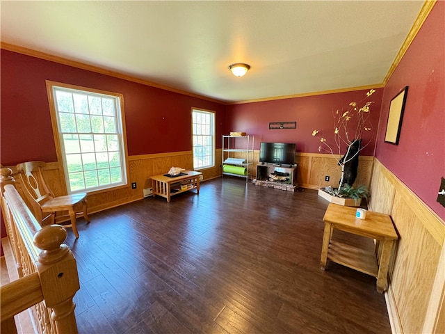 living room with dark wood-type flooring and ornamental molding