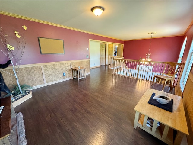 interior space featuring dark wood-type flooring, a chandelier, and crown molding