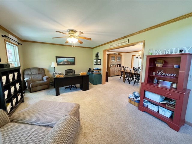 carpeted living room featuring ornamental molding and ceiling fan