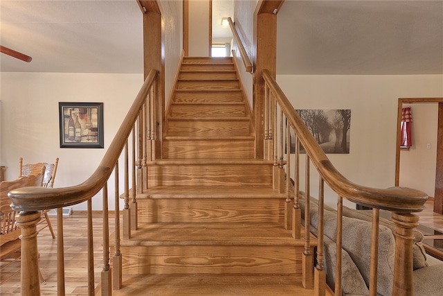 stairway with hardwood / wood-style floors