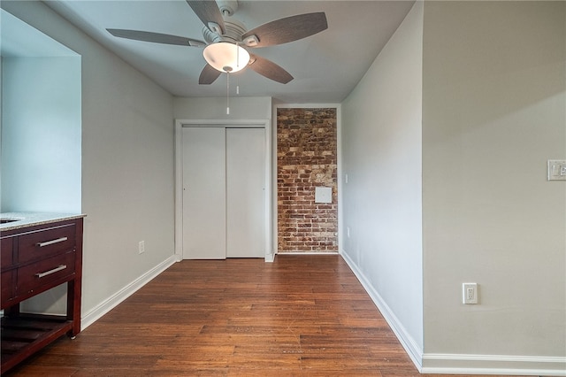 bedroom featuring a closet, ceiling fan, and dark hardwood / wood-style floors