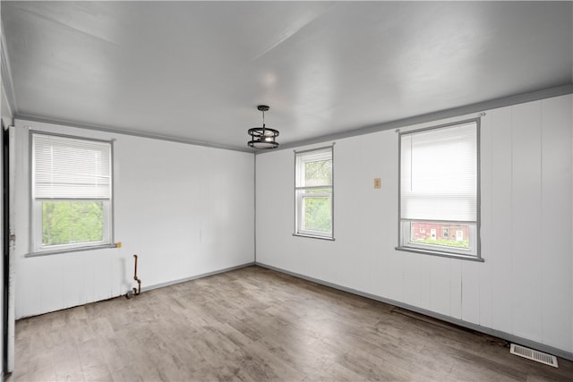 spare room featuring hardwood / wood-style floors