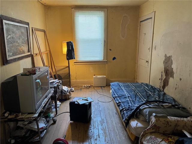 bedroom featuring hardwood / wood-style flooring