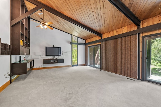 unfurnished living room with wooden ceiling, beam ceiling, and a wealth of natural light