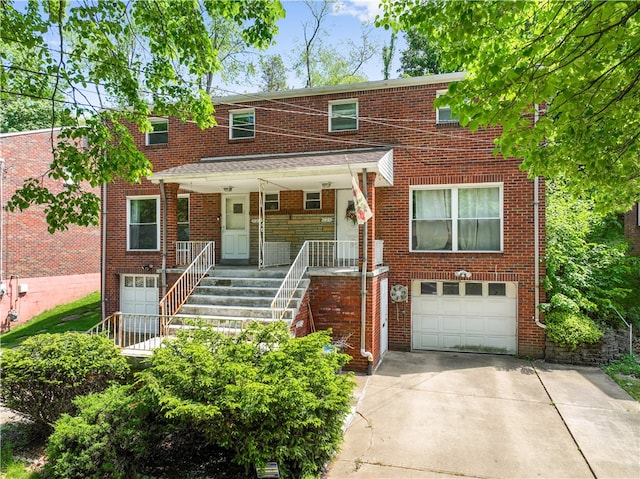 townhome / multi-family property with a garage and a porch