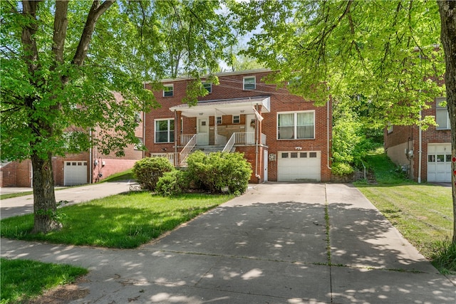 view of front of property with covered porch and a garage