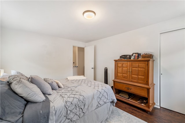 bedroom featuring dark hardwood / wood-style flooring