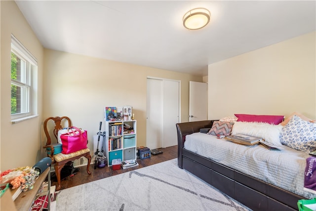 bedroom featuring a closet and dark hardwood / wood-style flooring