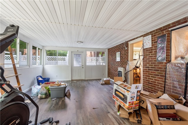 sunroom / solarium featuring wooden ceiling