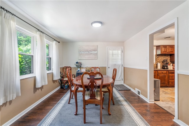 dining area featuring dark hardwood / wood-style flooring