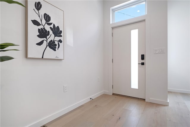 foyer with light wood-type flooring