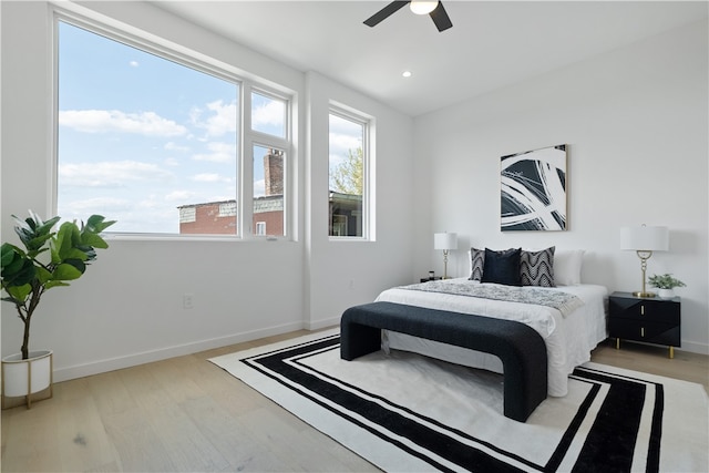 bedroom featuring light hardwood / wood-style floors and ceiling fan