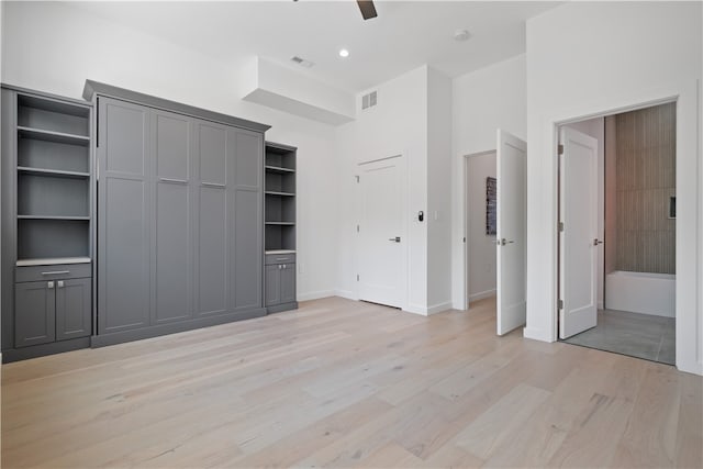 spare room featuring light hardwood / wood-style flooring and ceiling fan