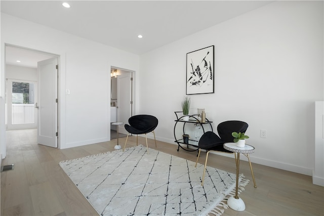 sitting room with light wood-type flooring