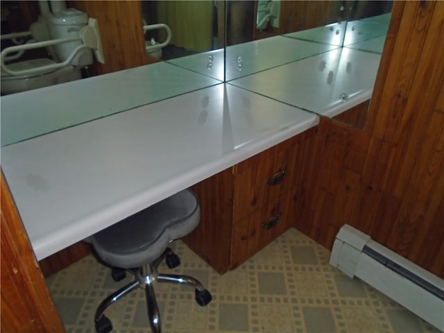 office with tile flooring and a baseboard radiator