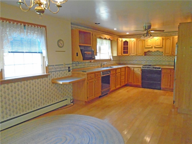 kitchen with backsplash, light hardwood / wood-style flooring, baseboard heating, range, and sink