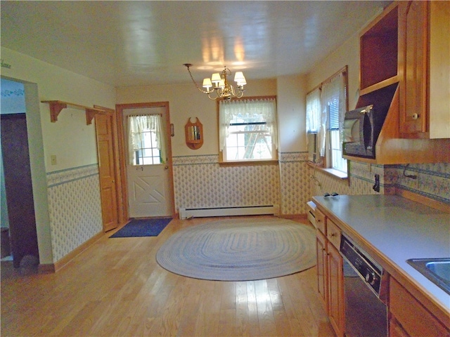 kitchen featuring stainless steel dishwasher, decorative light fixtures, light hardwood / wood-style flooring, baseboard heating, and an inviting chandelier