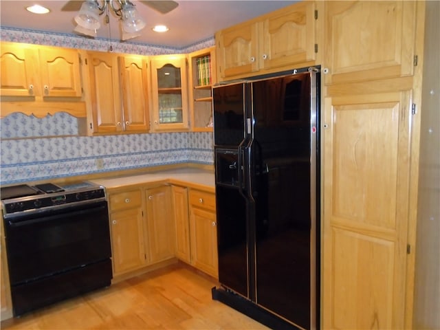 kitchen with ceiling fan, light hardwood / wood-style floors, and black appliances